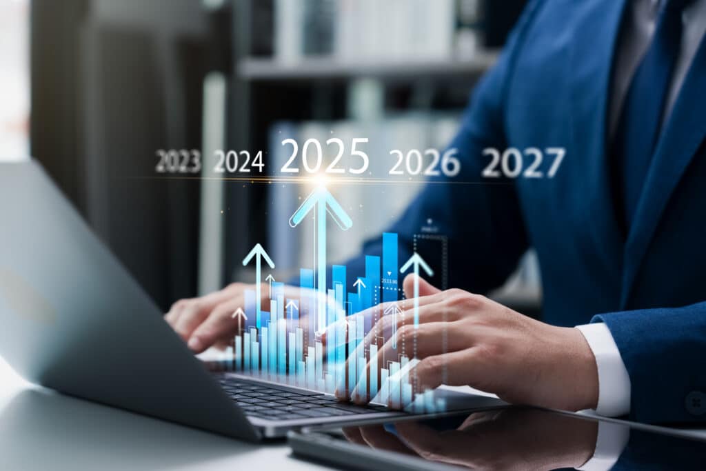 New Year's business operations plan in 2025, businessman doing business growth analysis in 2025, calculating financial data for investment Company's profitability, goals and success.