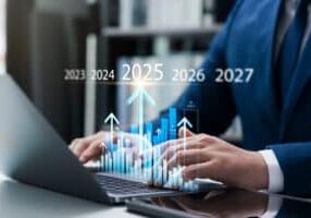 New Year's business operations plan in 2025, businessman doing business growth analysis in 2025, calculating financial data for investment Company's profitability, goals and success.