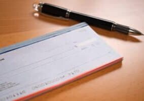 Checkbook desktop with pen ready for personal checking